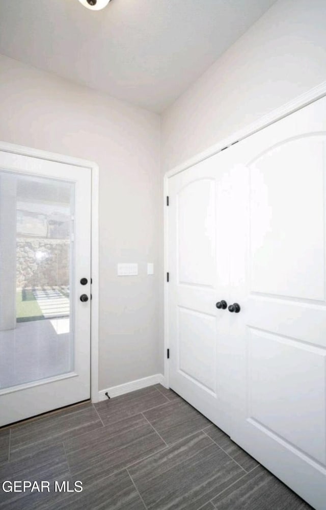 doorway with baseboards