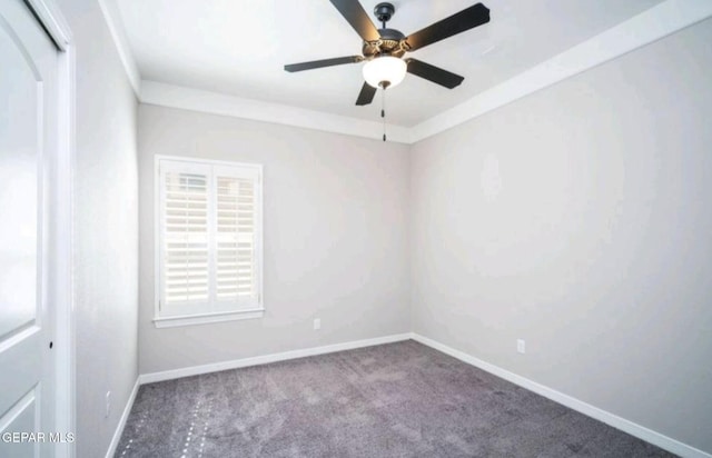 spare room with baseboards, ceiling fan, and carpet floors