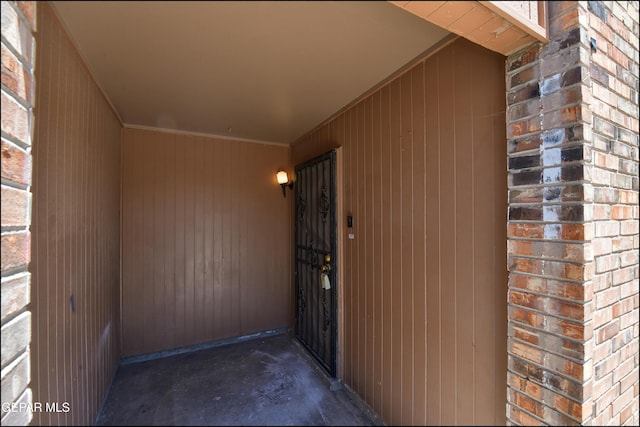 property entrance with brick siding