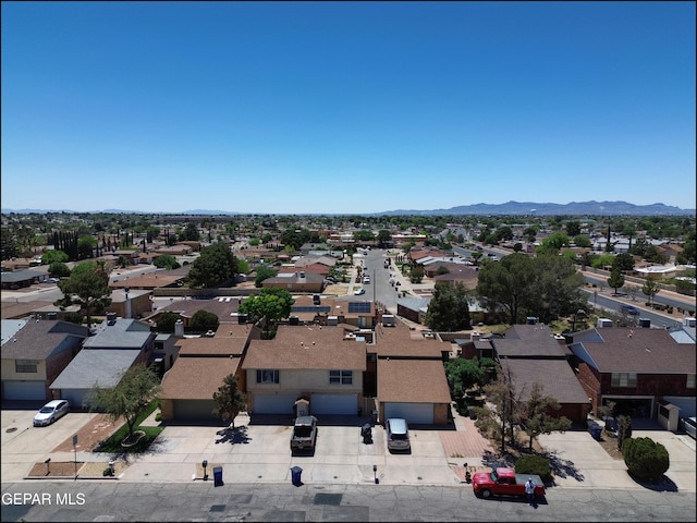 drone / aerial view featuring a residential view and a mountain view