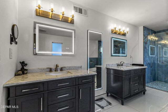 5673 Upper Valley Rd, El Paso, TX 79932 - bathroom with a sink, a shower stall, tile patterned floors, two vanities, and visible vents
