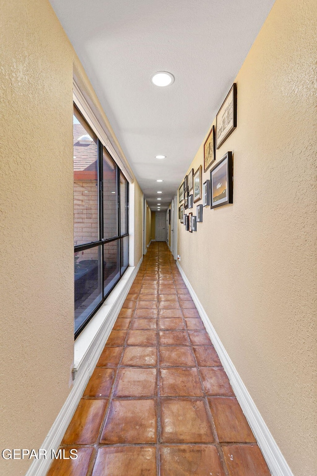 5673 Upper Valley Rd, El Paso, TX 79932 - corridor with recessed lighting, a textured wall, and baseboards