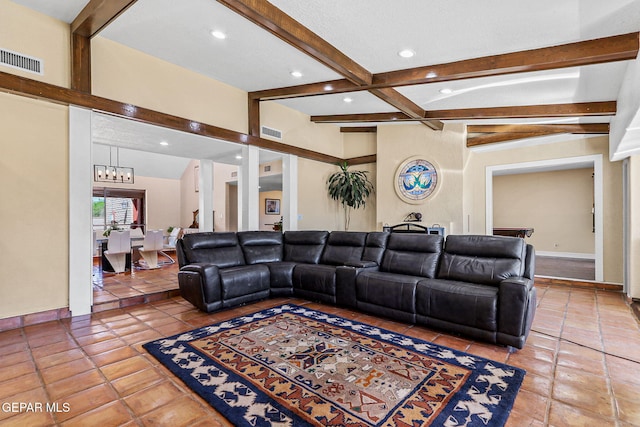 5673 Upper Valley Rd, El Paso, TX 79932 - living area with light tile patterned flooring, visible vents, a notable chandelier, and beamed ceiling