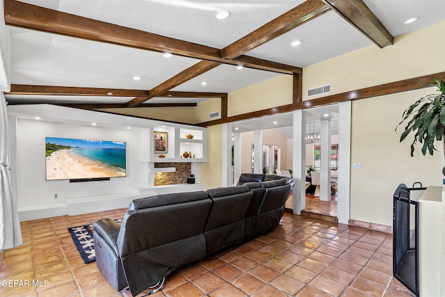 5673 Upper Valley Rd, El Paso, TX 79932 - living area featuring beamed ceiling, visible vents, and light tile patterned floors