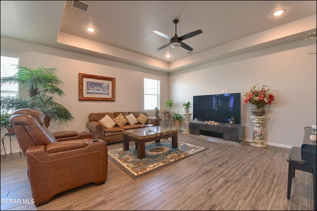 13162 Cleethorpes St, El Paso, TX 79928 - living room with visible vents, ceiling fan, wood finished floors, and a raised ceiling