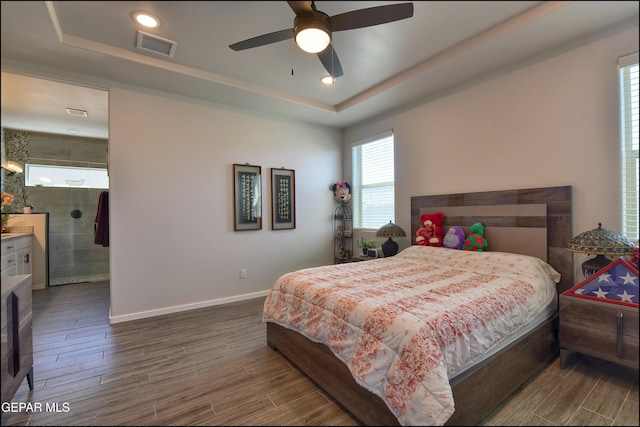 13162 Cleethorpes St, El Paso, TX 79928 - bedroom with dark wood-style floors, visible vents, a raised ceiling, and baseboards