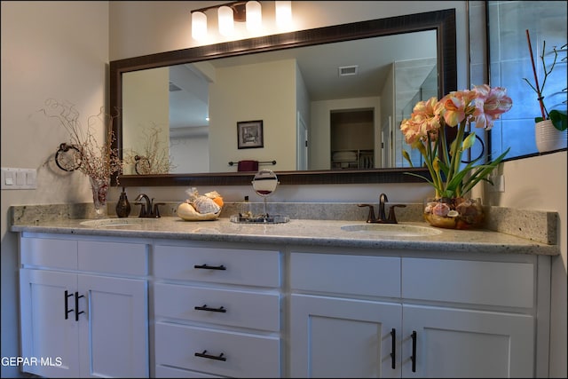 13162 Cleethorpes St, El Paso, TX 79928 - full bathroom with double vanity, visible vents, and a sink