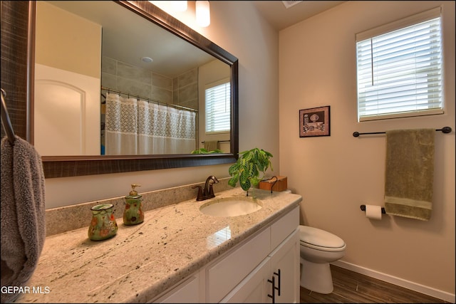 13162 Cleethorpes St, El Paso, TX 79928 - bathroom featuring wood finished floors, a shower with shower curtain, toilet, vanity, and baseboards