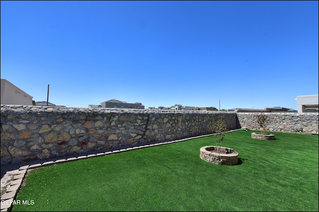 13162 Cleethorpes St, El Paso, TX 79928 - view of yard with a fire pit and a fenced backyard