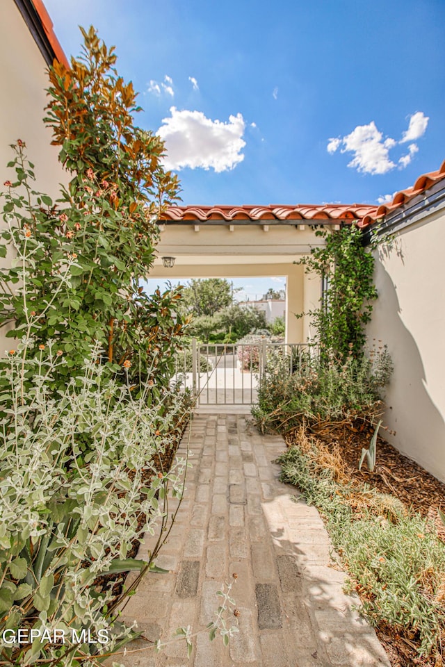 view of patio featuring a gate
