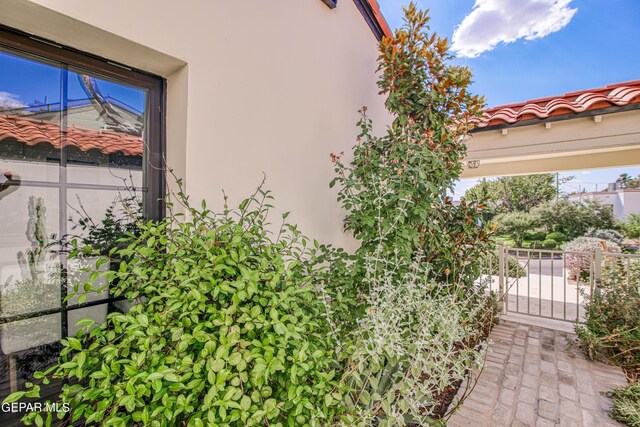 view of side of property featuring stucco siding