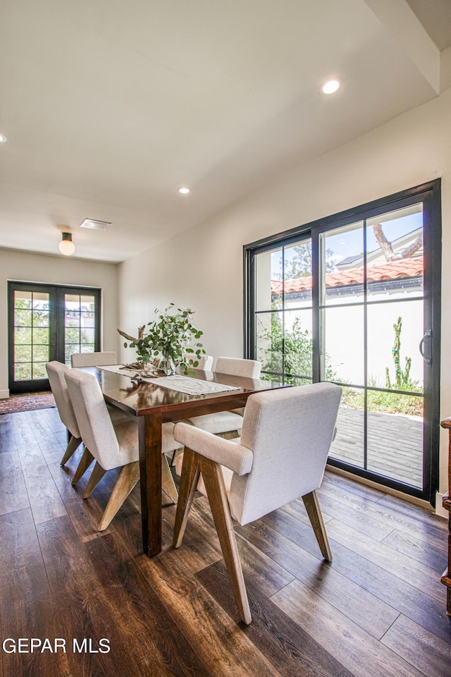 dining room with recessed lighting and dark wood-type flooring