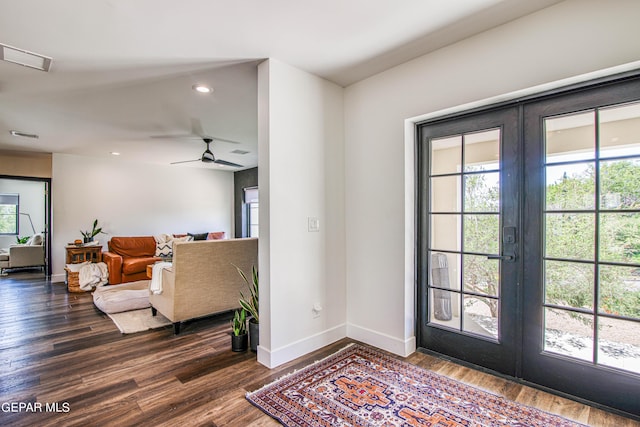 foyer entrance featuring dark wood-style floors, baseboards, french doors, and recessed lighting