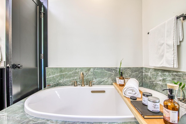 full bathroom with a freestanding tub