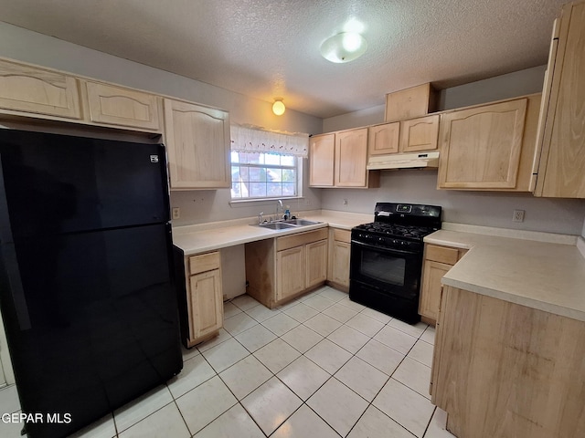 kitchen with black appliances, light brown cabinets, under cabinet range hood, and a sink
