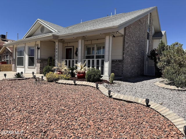 10933 Chippendale Ave, El Paso, TX 79934 - single story home featuring brick siding, a shingled roof, and a porch