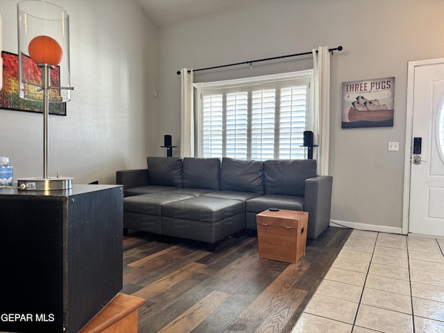 living area featuring baseboards and wood finished floors