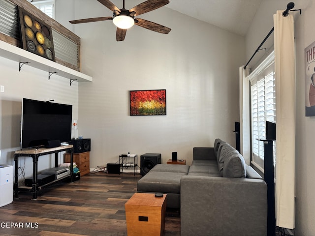 living room with ceiling fan, wood finished floors, and high vaulted ceiling
