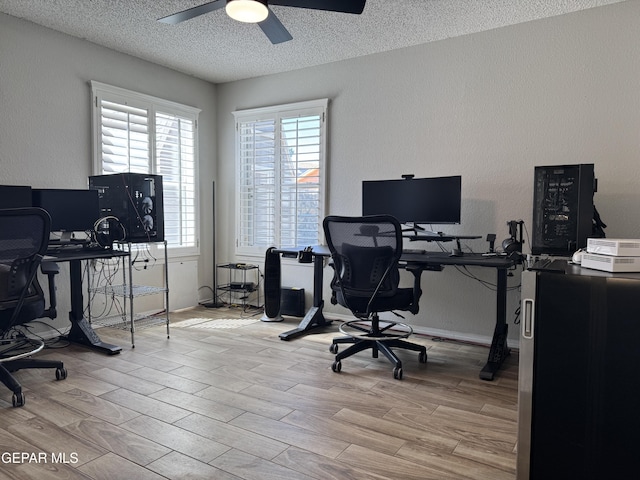 office space featuring a ceiling fan, a textured ceiling, and wood finished floors