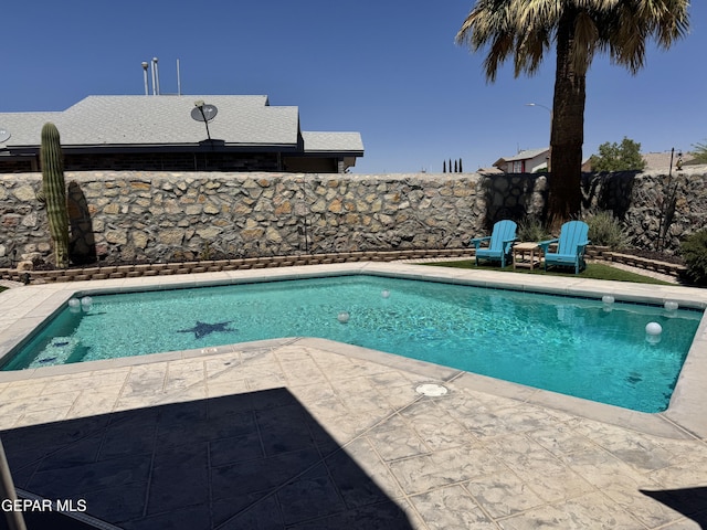 view of pool with a fenced in pool and a patio area