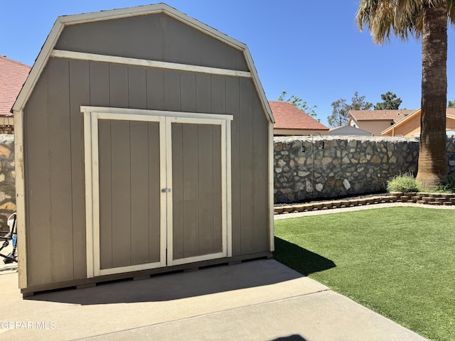view of shed with fence