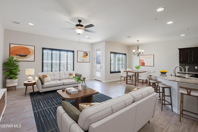 13145 Hazy, El Paso, TX 79938 - living area featuring plenty of natural light, recessed lighting, light wood-style floors, and a chandelier