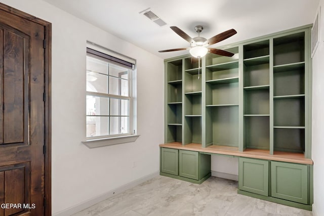 337 Vin Almoradi Ct, El Paso, TX 79912 - unfurnished office with built in desk, visible vents, baseboards, a ceiling fan, and marble finish floor