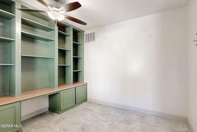 337 Vin Almoradi Ct, El Paso, TX 79912 - interior space featuring ceiling fan, marble finish floor, visible vents, built in study area, and baseboards