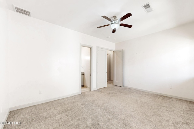 337 Vin Almoradi Ct, El Paso, TX 79912 - unfurnished bedroom with ensuite bathroom, visible vents, light colored carpet, and baseboards