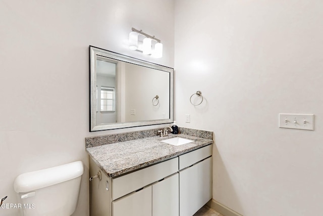 337 Vin Almoradi Ct, El Paso, TX 79912 - half bathroom with toilet, vanity, and baseboards