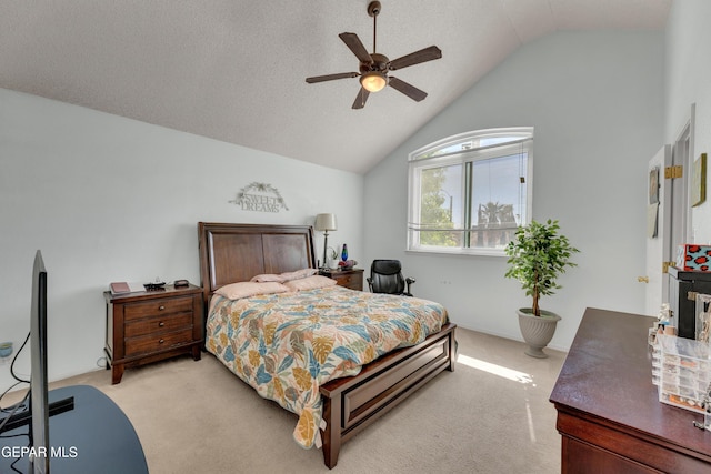 bedroom with lofted ceiling, ceiling fan, and light carpet