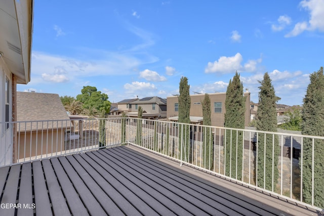 wooden deck featuring a residential view