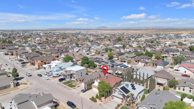 drone / aerial view with a residential view and a mountain view