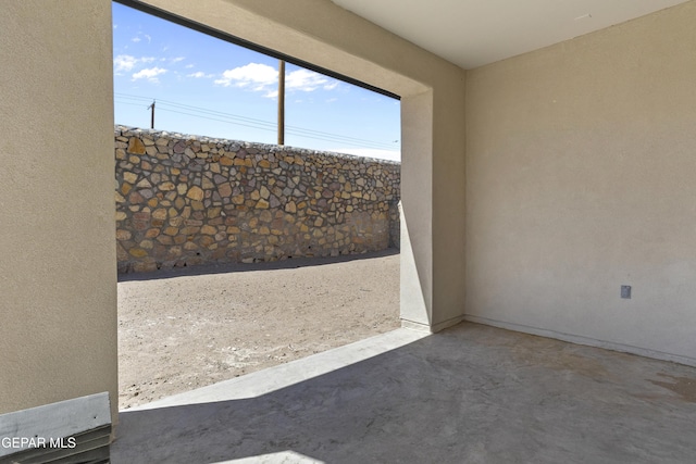 spare room featuring concrete floors