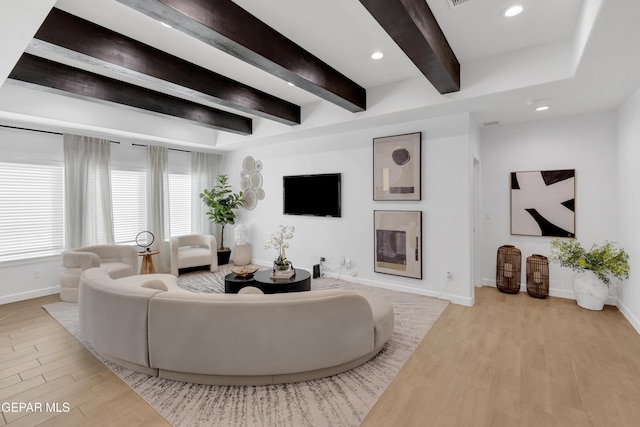 living area featuring baseboards, recessed lighting, beam ceiling, and wood finished floors