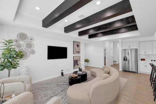 living room with recessed lighting, baseboards, beam ceiling, and light wood-type flooring