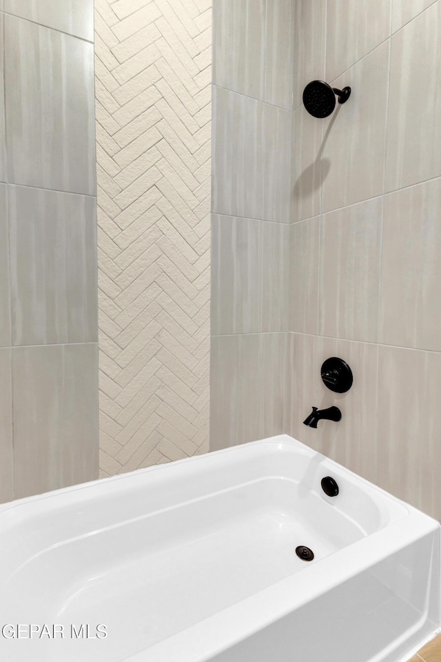 full bathroom with tile walls