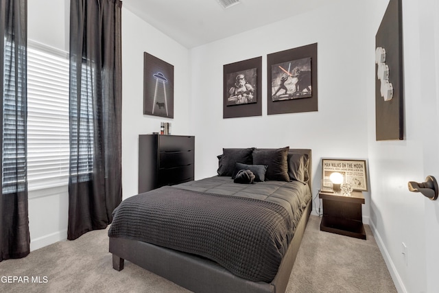 bedroom with baseboards, carpet flooring, and visible vents
