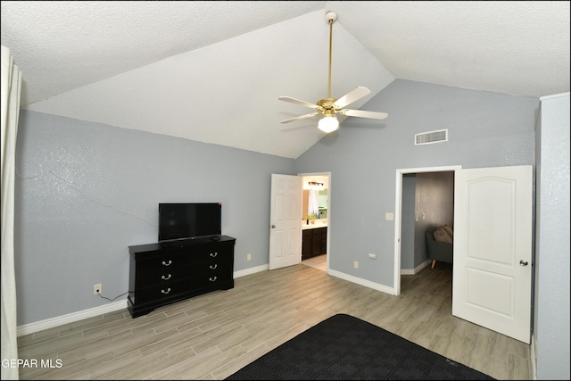 unfurnished bedroom featuring high vaulted ceiling, visible vents, ceiling fan, light wood-style flooring, and baseboards