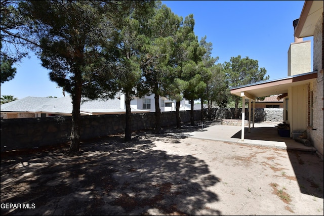 view of yard with a fenced backyard and a patio area