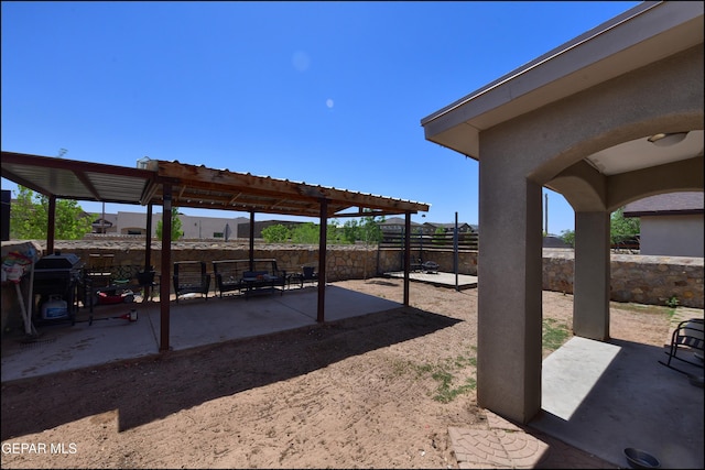 fenced backyard with a patio area and a pergola