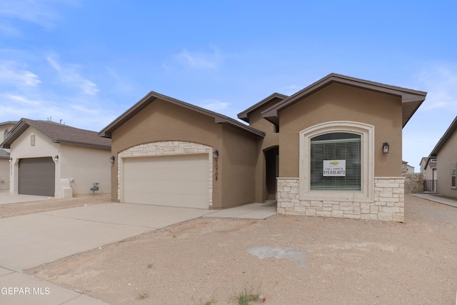 ranch-style home featuring stone siding, stucco siding, a garage, and concrete driveway