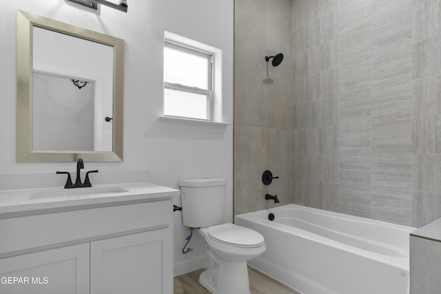 bathroom featuring vanity, toilet, and tub / shower combination