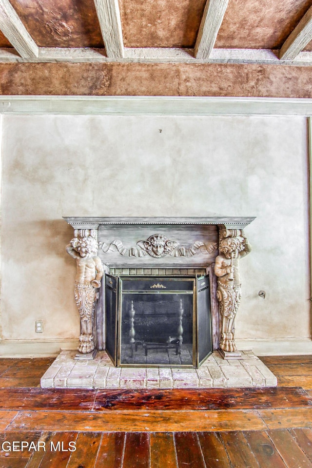 6041 Torrey Pines Dr, El Paso, TX 79912 - interior details with a fireplace with raised hearth, wood finished floors, and baseboards