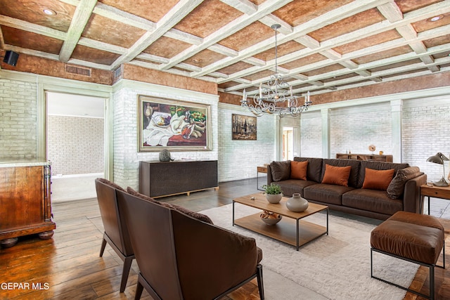 6041 Torrey Pines Dr, El Paso, TX 79912 - living area with a chandelier, coffered ceiling, wood-type flooring, beam ceiling, and brick wall