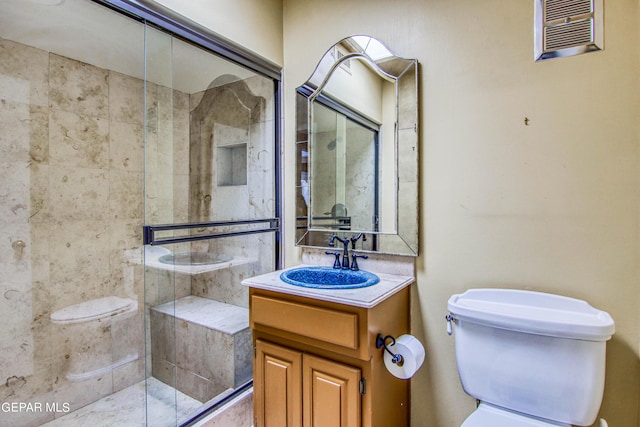 6041 Torrey Pines Dr, El Paso, TX 79912 - full bathroom with toilet, a stall shower, visible vents, and vanity
