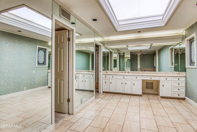 6041 Torrey Pines Dr, El Paso, TX 79912 - bathroom with crown molding, wallpapered walls, and vanity