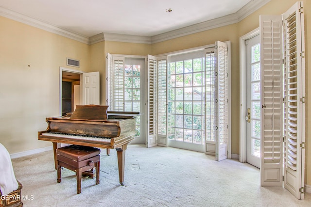 6041 Torrey Pines Dr, El Paso, TX 79912 - living area featuring ornamental molding, visible vents, carpet, and baseboards