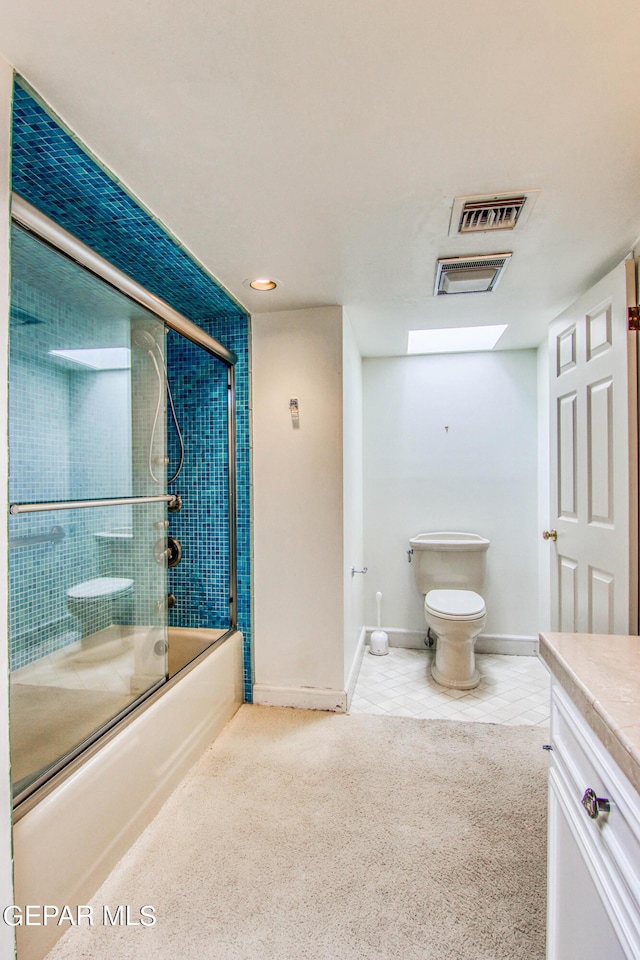 6041 Torrey Pines Dr, El Paso, TX 79912 - bathroom with tile patterned floors, shower / bath combination with glass door, toilet, vanity, and visible vents