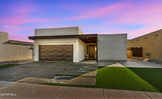 1725 Eased St, El Paso, TX 79928 - contemporary house with driveway, a garage, and stucco siding